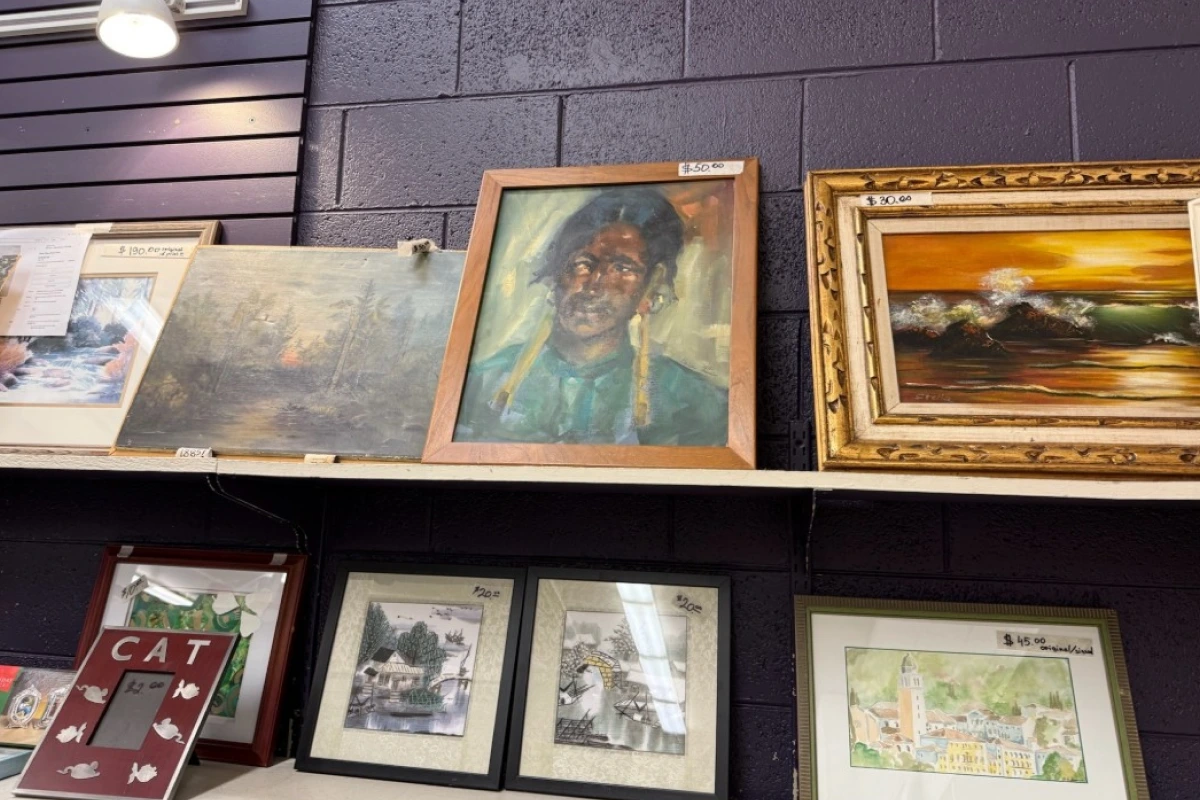 couple of picture frames and paintings